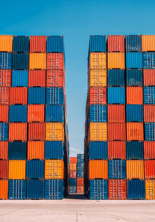 Shipping containers stacked in a cargo terminal yard